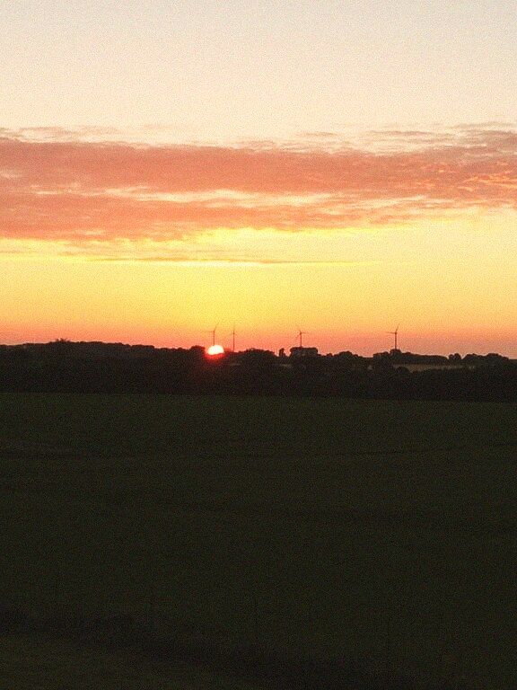Champ · coucher de soleil